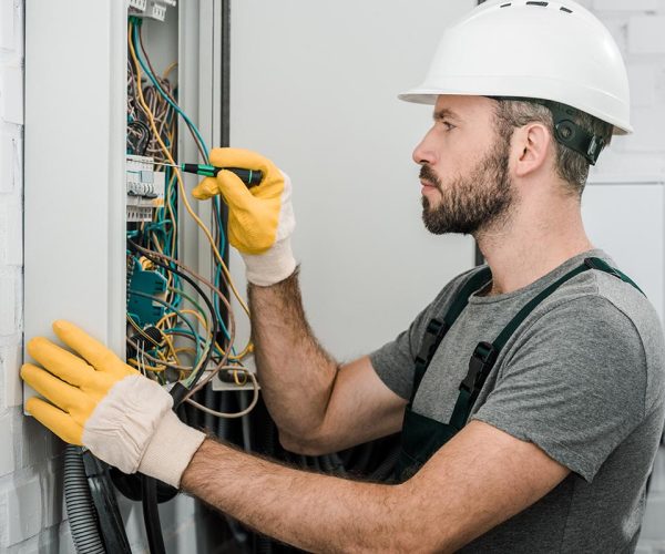 side-view-of-handsome-bearded-electrician-repairin-resize.jpg czxczx